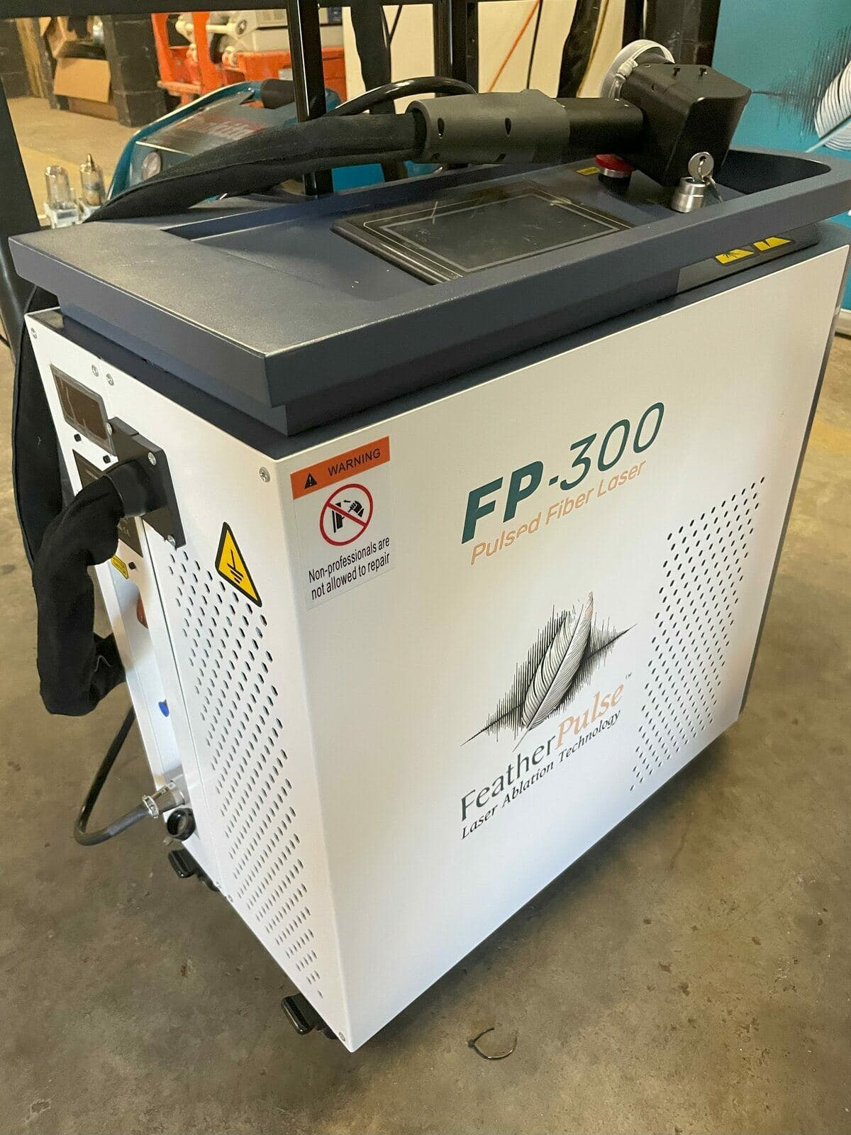 The FeatherPulse FP-300 300-watt pulsed fiber laser used on every job